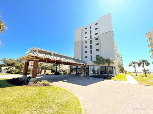 view of building exterior featuring a carport