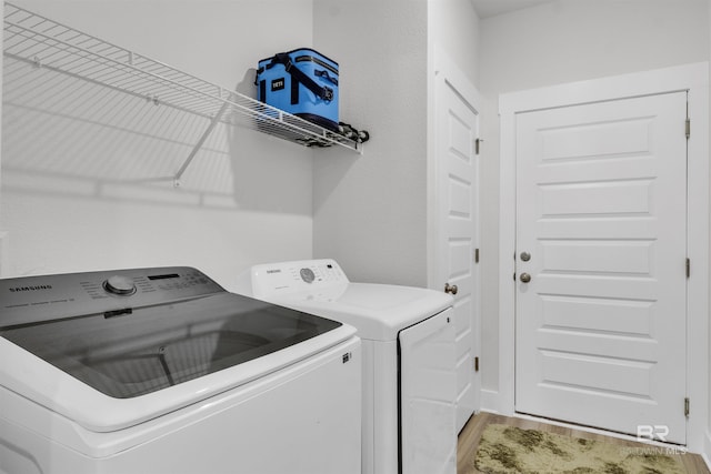 9983 Willet Way, Foley, AL 36535 - washroom featuring washing machine and clothes dryer and light wood finished floors
