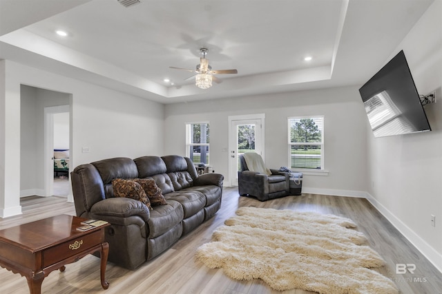 9983 Willet Way, Foley, AL 36535 - living room with a tray ceiling, a ceiling fan, plenty of natural light, recessed lighting, and light wood-style floors