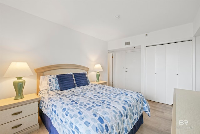 bedroom featuring a closet and light hardwood / wood-style flooring