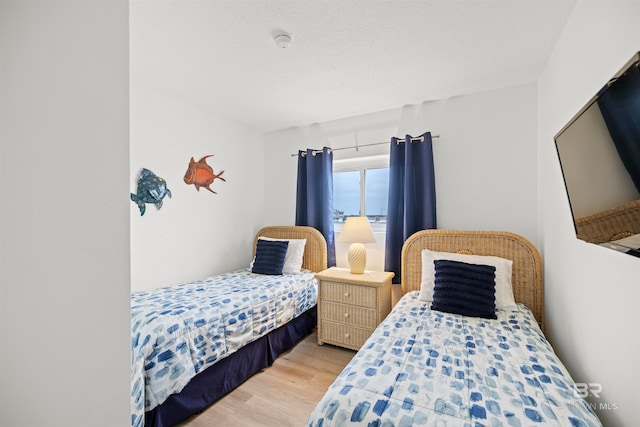 bedroom with light wood-type flooring