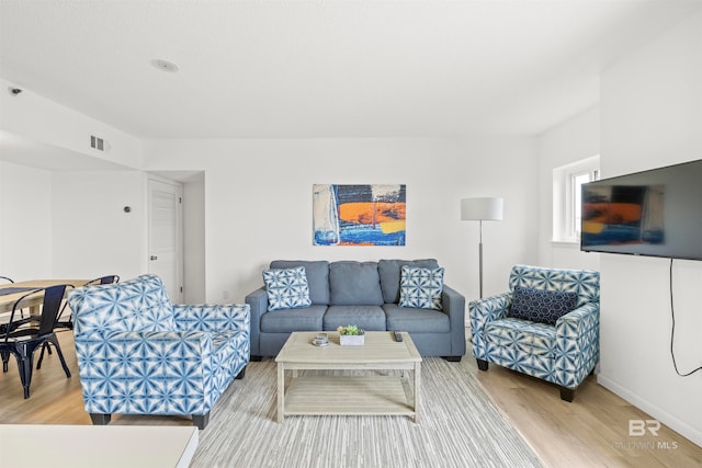 living room with light hardwood / wood-style floors