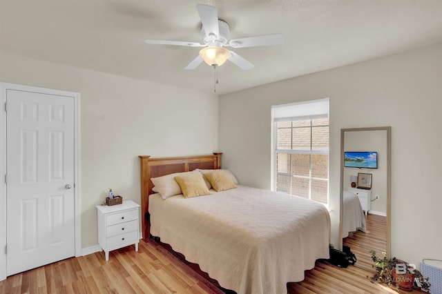 bedroom featuring ceiling fan and light hardwood / wood-style flooring