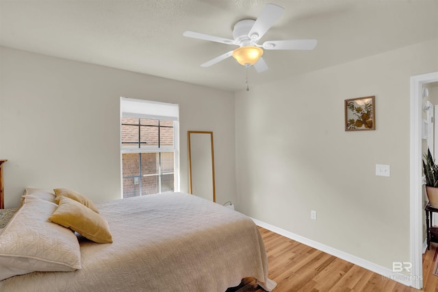 bedroom featuring light hardwood / wood-style floors and ceiling fan