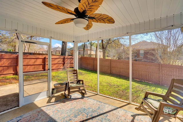 unfurnished sunroom with wooden ceiling and ceiling fan