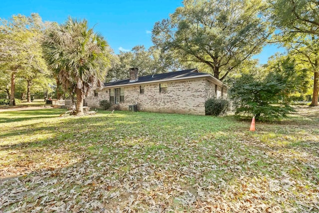 rear view of house with a lawn