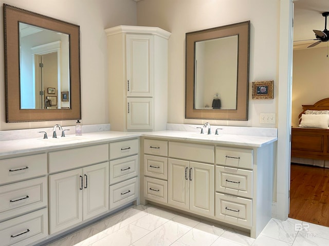 bathroom with vanity, hardwood / wood-style flooring, and ceiling fan