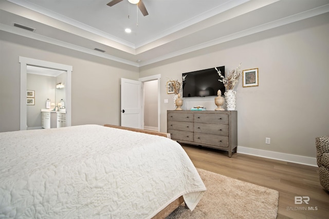 bedroom featuring ceiling fan, crown molding, and light wood-type flooring