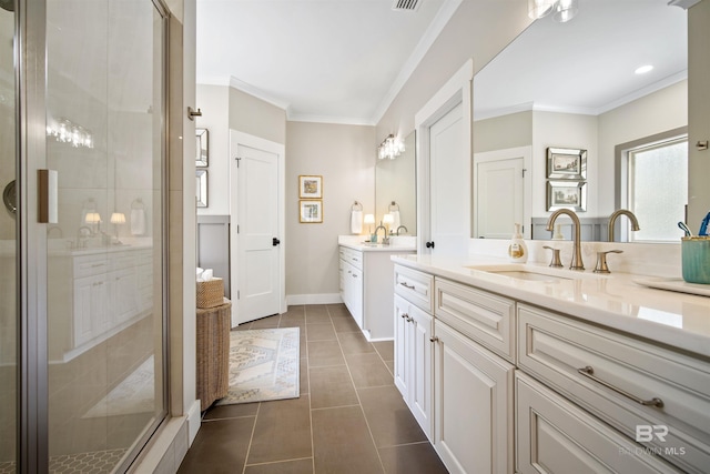 bathroom featuring tile patterned flooring, vanity, an enclosed shower, and crown molding