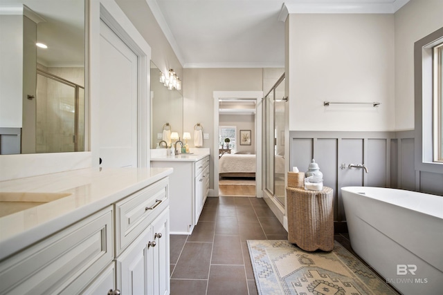 bathroom with tile patterned flooring, vanity, separate shower and tub, and crown molding