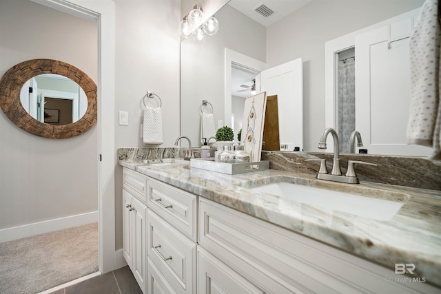 bathroom featuring vanity, tile patterned floors, and ceiling fan