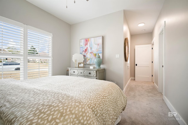 bedroom featuring light carpet