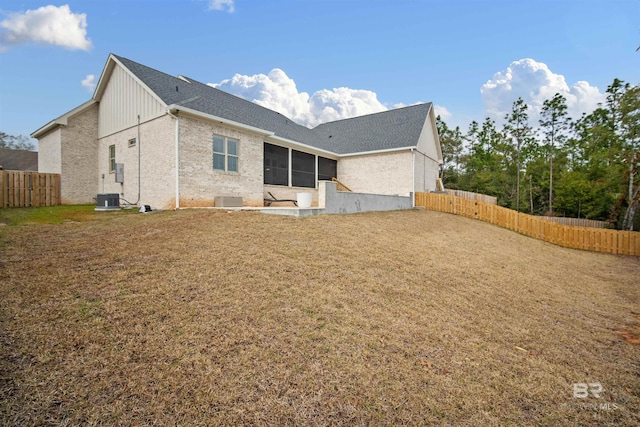 rear view of property featuring central air condition unit