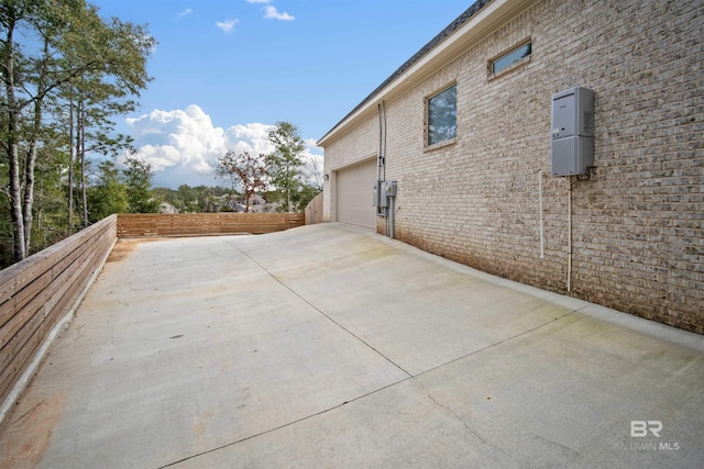 view of side of home featuring a garage