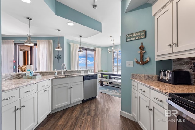 25250 Perdido Beach Blvd Unit 304E, Orange Beach, AL 36561 - kitchen featuring pendant lighting, a sink, tasteful backsplash, dishwasher, and dark wood-style flooring
