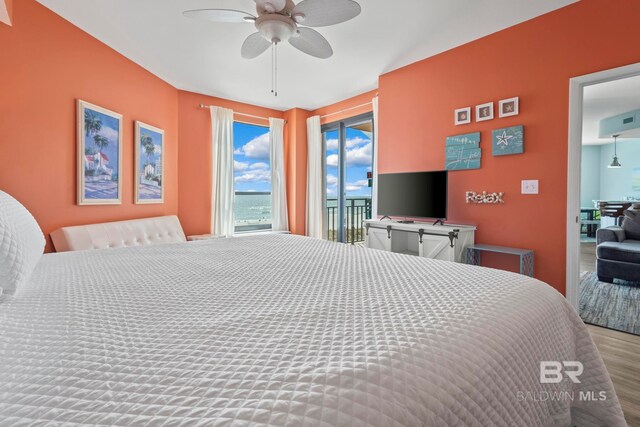 25250 Perdido Beach Blvd Unit 304E, Orange Beach, AL 36561 - bedroom featuring access to exterior, a ceiling fan, and wood finished floors