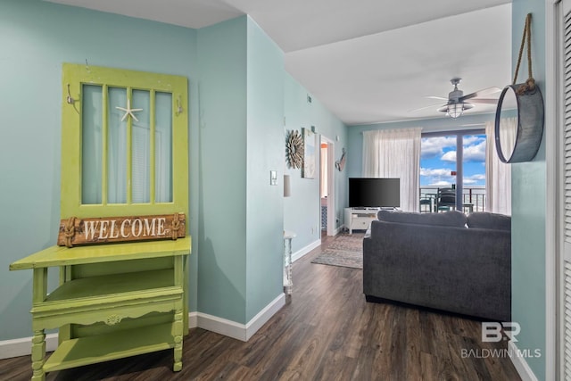 25250 Perdido Beach Blvd Unit 304E, Orange Beach, AL 36561 - living room featuring baseboards, a ceiling fan, and dark wood-style flooring