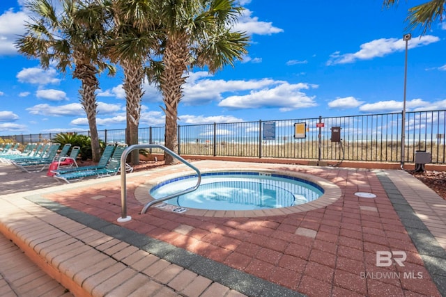 25250 Perdido Beach Blvd Unit 304E, Orange Beach, AL 36561 - view of swimming pool with fence and a hot tub