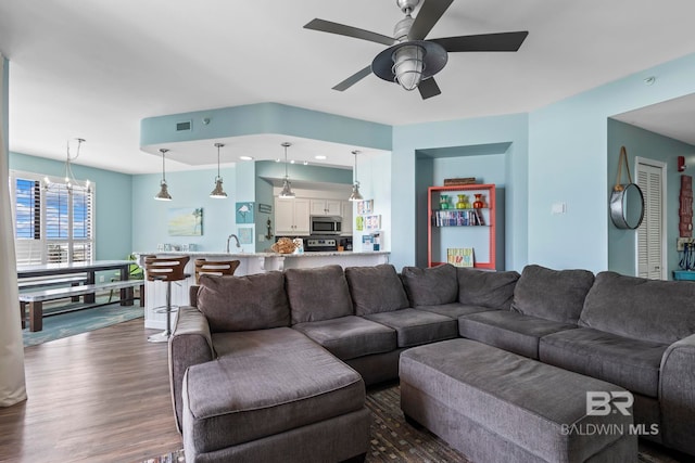 25250 Perdido Beach Blvd Unit 304E, Orange Beach, AL 36561 - living area featuring recessed lighting, ceiling fan with notable chandelier, and dark wood-style flooring