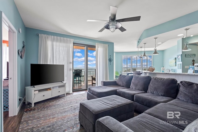 25250 Perdido Beach Blvd Unit 304E, Orange Beach, AL 36561 - living area with ceiling fan with notable chandelier and wood finished floors