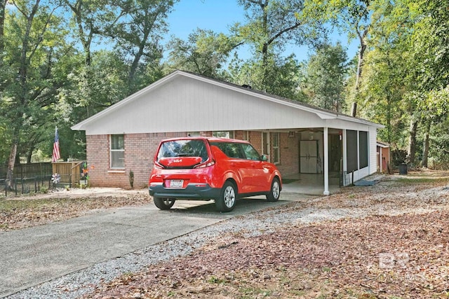 view of side of property with a carport