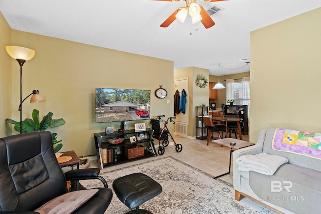 living room with ceiling fan