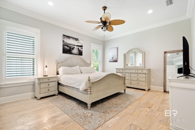 bedroom with multiple windows, light wood-type flooring, and ornamental molding