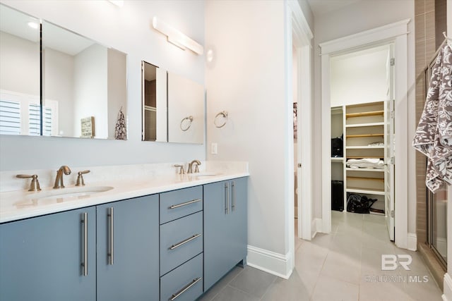 bathroom featuring tile patterned floors and double vanity