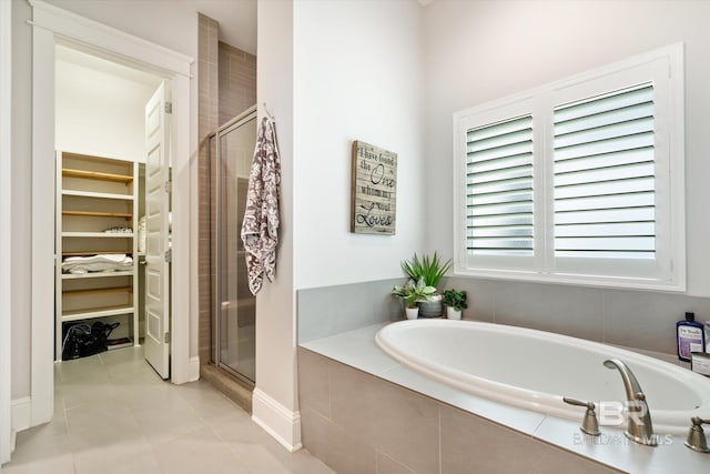 bathroom with plenty of natural light, independent shower and bath, and tile patterned flooring