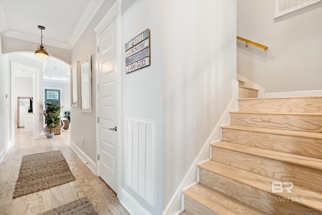 interior space with crown molding