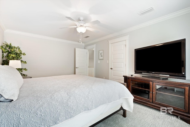 bedroom featuring ceiling fan and crown molding