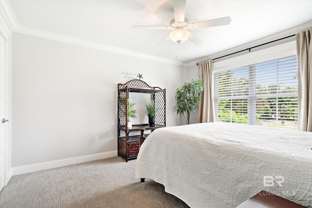 bedroom with carpet floors, crown molding, and ceiling fan