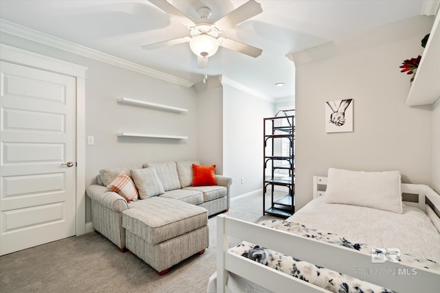 bedroom featuring carpet flooring, crown molding, and ceiling fan