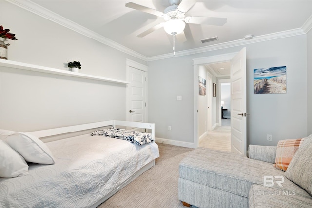 bedroom with ornamental molding, light colored carpet, and ceiling fan