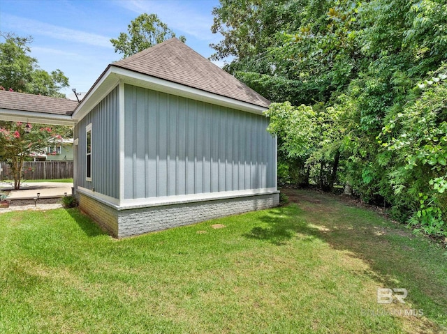 view of home's exterior with a lawn