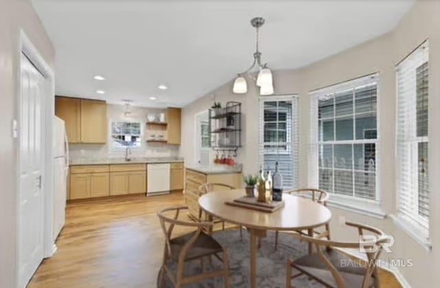 dining area featuring light wood-type flooring