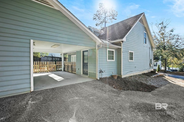 view of home's exterior with a carport