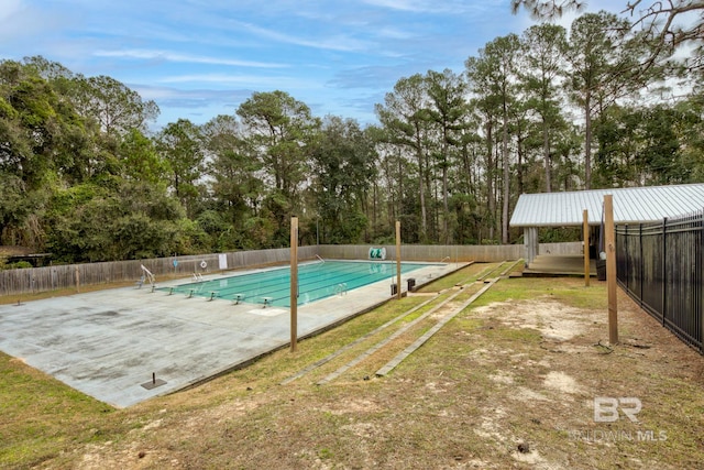 view of swimming pool featuring a patio area