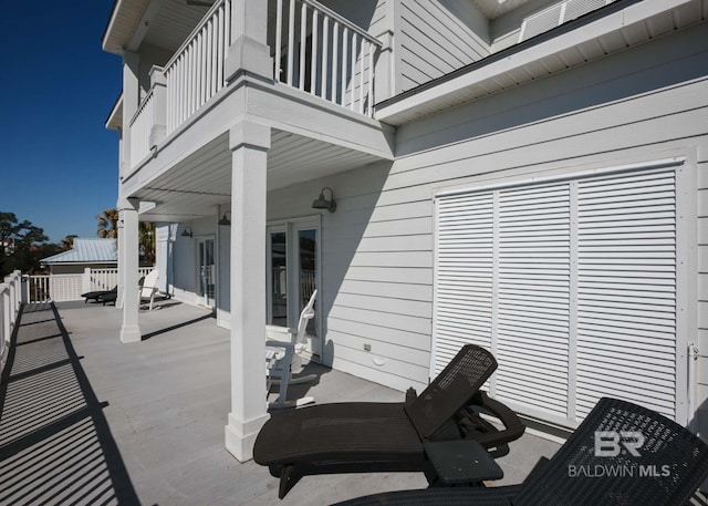 view of patio with a balcony
