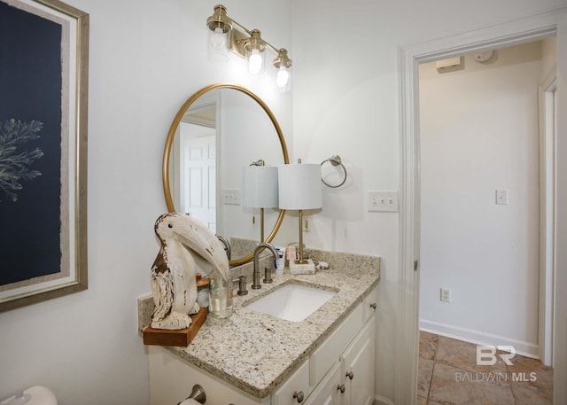 bathroom featuring vanity and baseboards