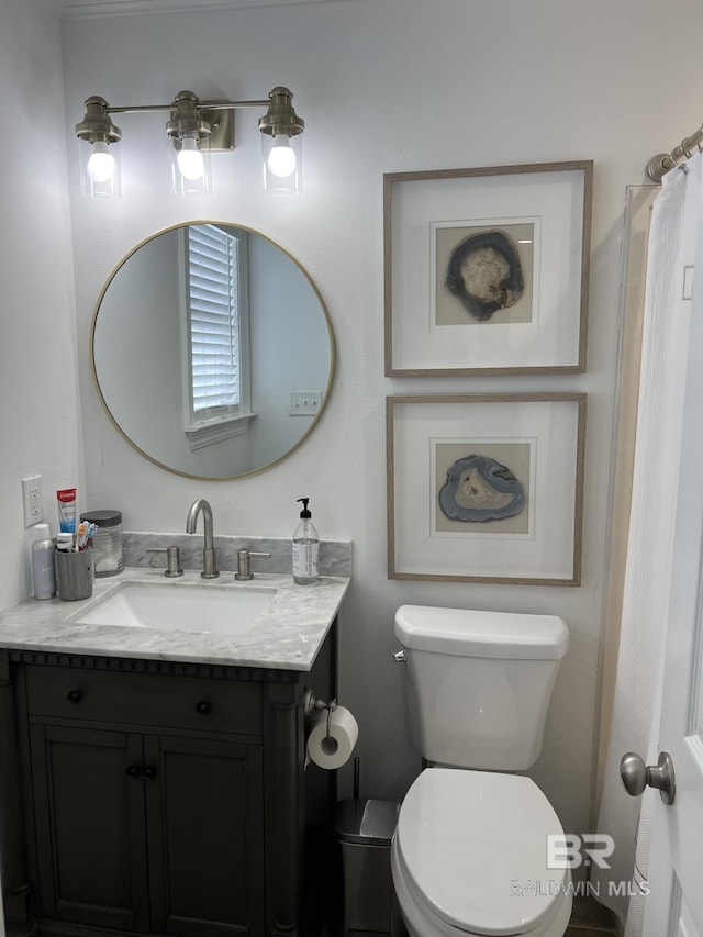 full bathroom with vanity and toilet