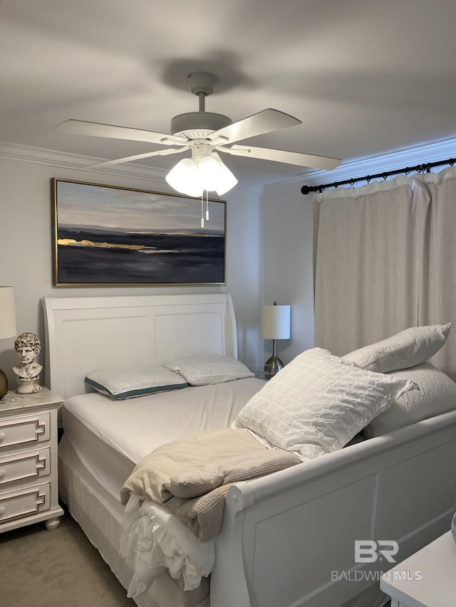 bedroom featuring carpet floors, a ceiling fan, and crown molding