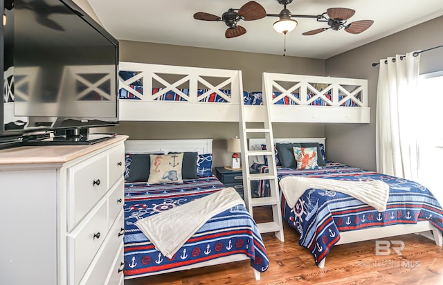 bedroom featuring ceiling fan and wood-type flooring