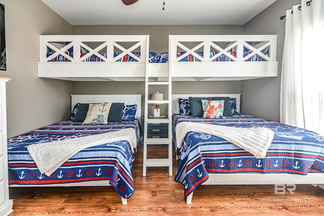 bedroom with wood-type flooring and ceiling fan