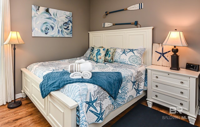 bedroom featuring dark hardwood / wood-style floors