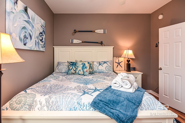 bedroom with wood-type flooring