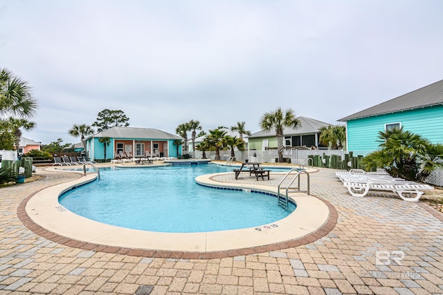 view of swimming pool featuring a patio area