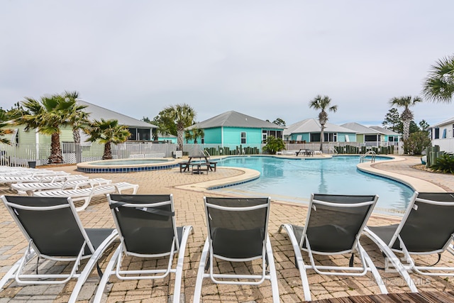 view of swimming pool with a patio area