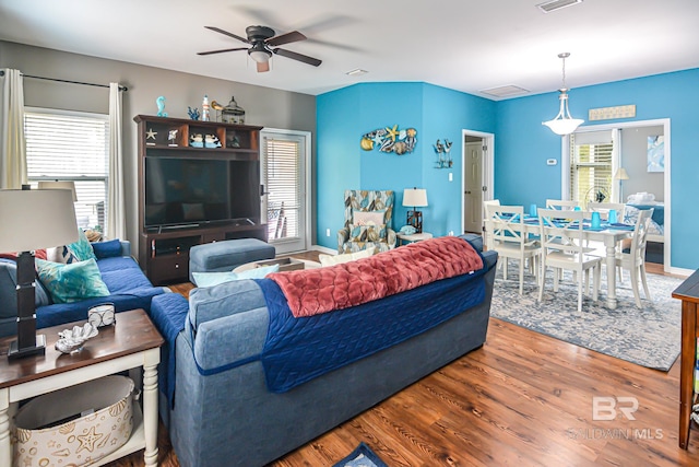 living room with plenty of natural light, ceiling fan, and hardwood / wood-style flooring