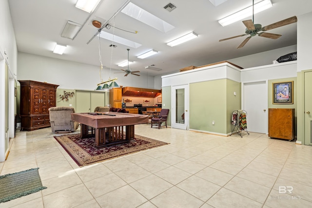 606 Fairhope Ave, Fairhope, AL 36532 - game room featuring a ceiling fan, light tile patterned flooring, and a skylight